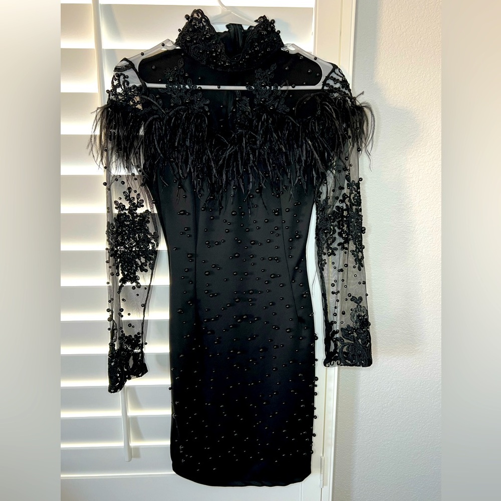 black cocktail dress with feather and pearl details